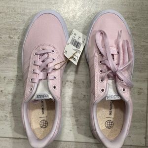 Woman’s size 9 adidas pink skateboard shoes never worn and still have tag.